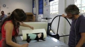 Lifting paper from the plate to reveal fine art print